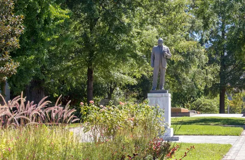 Martin Luther King statue among lush greenery