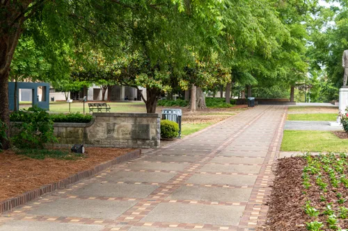 Wide diagonal pathways cross the park