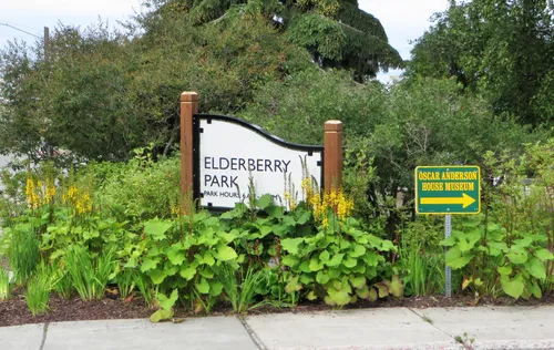 Entrance sign and lush greenery welcome visitors to Elderberry Park