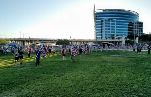Visitors carrying flags during the Tempe Healing Field event