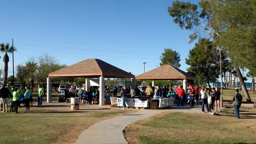 Visitors gather under pavilions during a special event