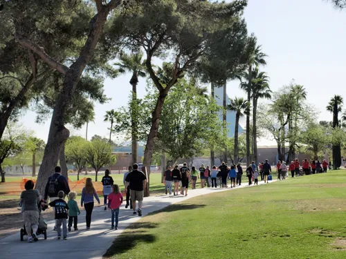 Park visitors walking toward the Edith Ball Adaptive Recreation Center
