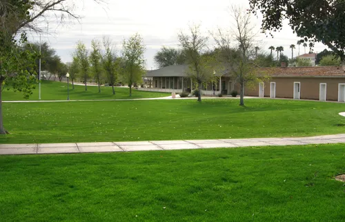 Preserved historic buildings nestled among green lawns