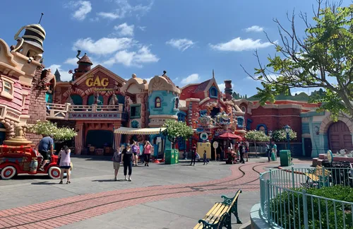 The colorful buildings of Toontown welcome visitors on a sunny afternoon