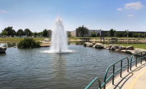 Water fountain creates a refreshing focal point in the park's pond