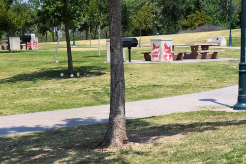Picnic areas with tables on the park's well-maintained grounds