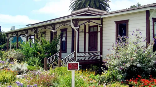 Historic house surrounded by colorful wildflower gardens