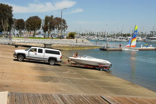 Truck and boat trailer at the wide boat launching ramp
