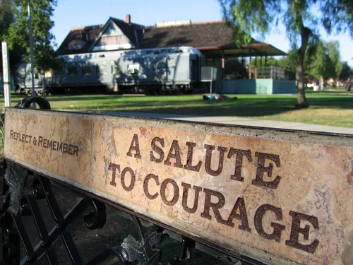 Closeup view of an inscription on a memorial bench