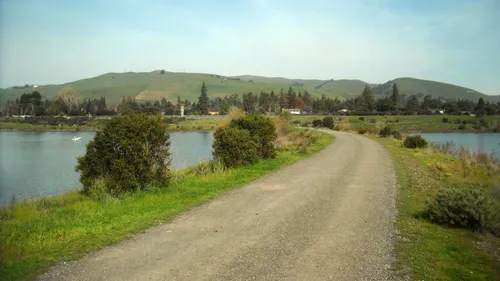 Gravel path separates Horseshoe Lake and Lago Los Osos