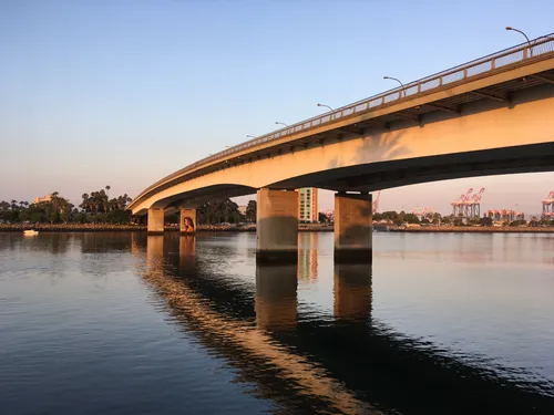 Queensway Twin Bridges spanning across Los Angeles River at sunset