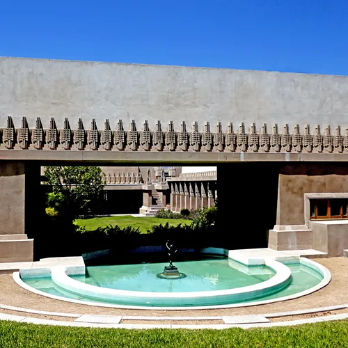 Circular water feature complements the building's strong architectural elements