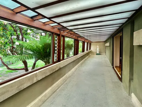 Covered walkway connects different sections of the historic structure