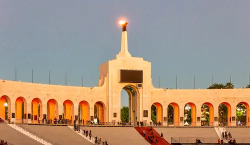 The Olympic Torch at the LA Memorial Coliseum as dusk falls