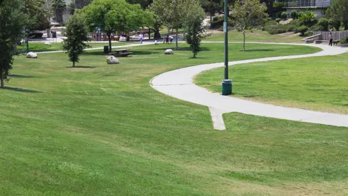 Pathways curve through the grassy landscape of the park
