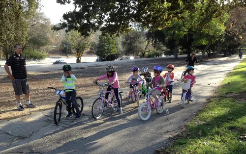 Children on bicycles enjoying an afternoon in the park