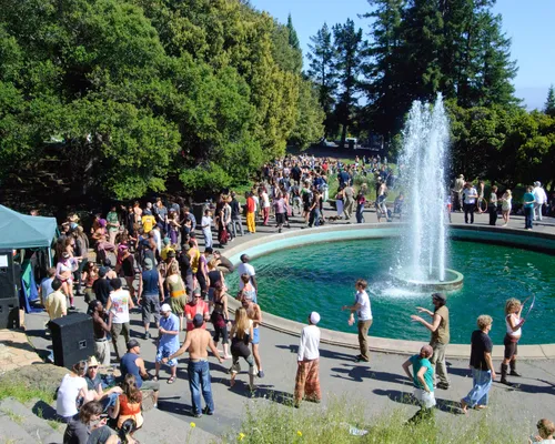 Visitors near the circular fountain below the amphitheater