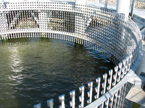 Wave Oculus by Ned Kahn lines its circular pier with thousands of stainless steel mirrors reflecting the Oakland Estuary