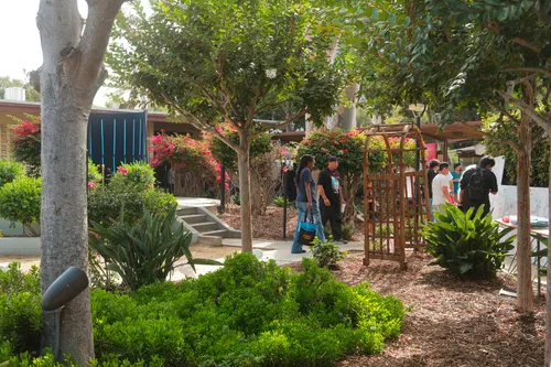 Visitors in the courtyard of the community center