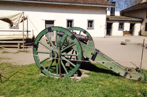 Green cannon displayed on the park grounds