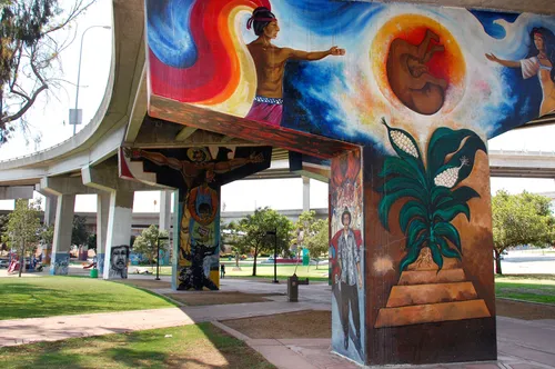 Vibrant mural art brightens the underside of the highway overpass