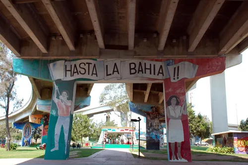 Text and art adorns colorful support columns