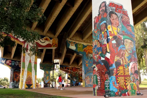 Detailed cultural murals transform concrete pillars into art