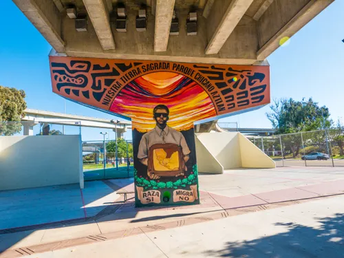Brightly painted support column featuring a vibrant mural
