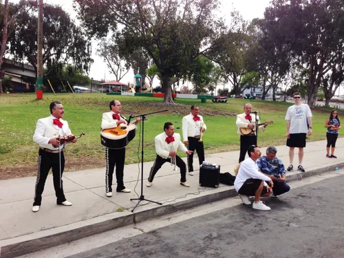 Mariachi band performs at the edge of the park