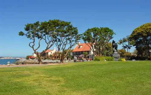 The park's open lawn is dotted with sculptural coastal trees