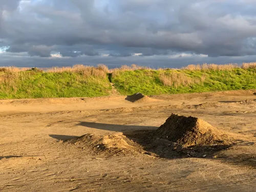 Dramatic cloudy sky over coastal dunes