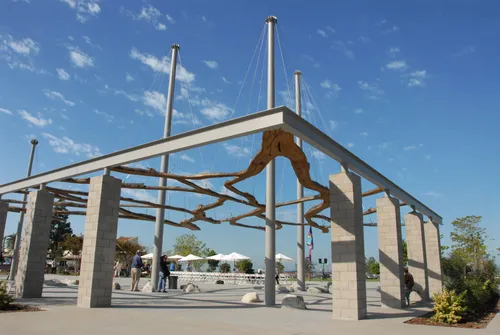 The Riparium art installation welcomes visitors with suspended eucalyptus sections