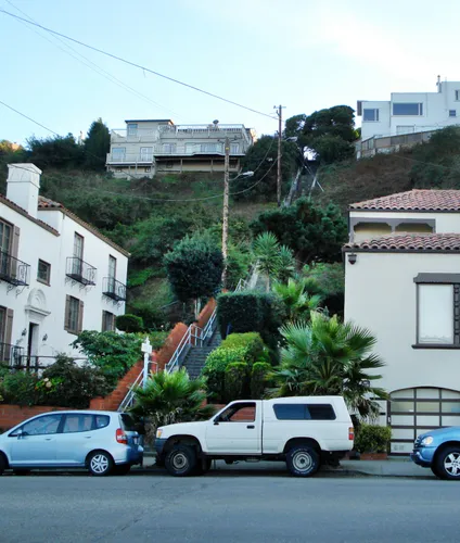 Lush plantings line the steps that lead up toward Lawton Street