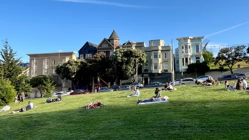 Visitors enjoying the park's green space on an afternoon
