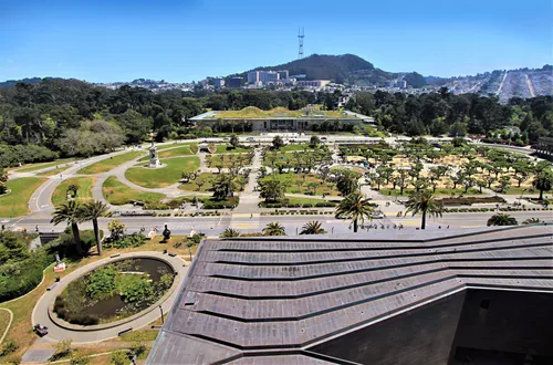 Elevated view toward California Academy of Sciences with Sutro Tower in the distance