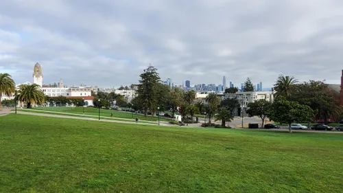 Sweeping view of the lawn with city buildings in the distance