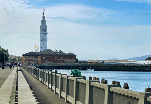 The park's waterfront promenade leads to the historic Ferry Building with its clocktower