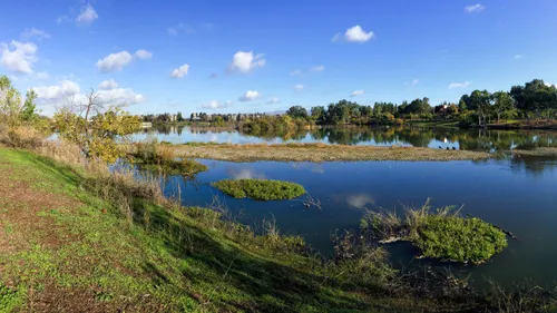 The lake's clear blue waters offer scenic views
