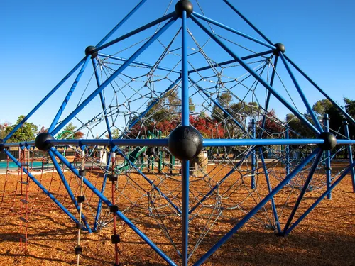 Blue climbing structure in the playground area