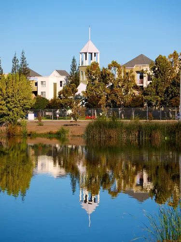 Buildings reflected in the still waters of Almaden Lake