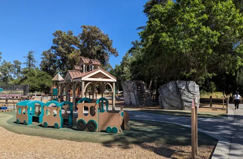 A cyan train structure invites kids to hop on board