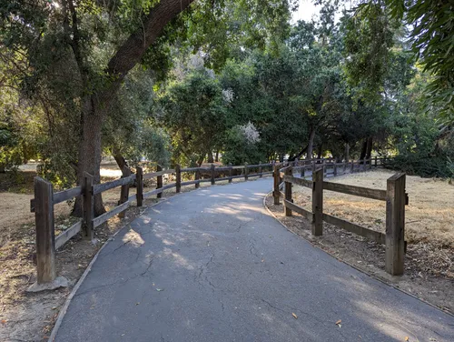 Wooden fences line one of the quiet walking paths