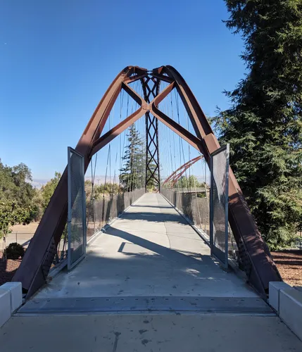 Large bridge connects parking lot to Happy Hollow Park entrance