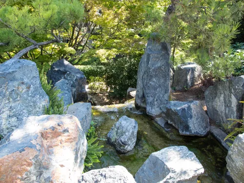 Rocky formations add natural texture to the Japanese garden landscape