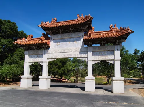 The Chinese Friendship Gate stands south of the central pond