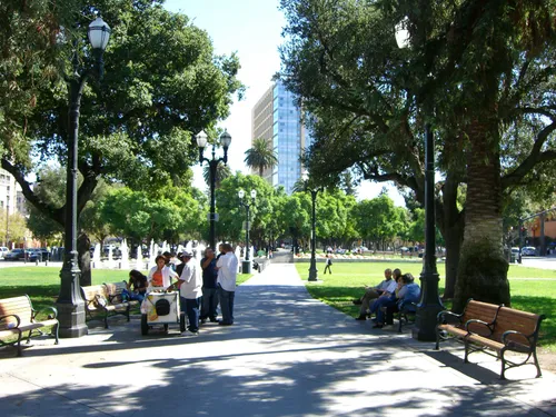 Quetzalcóatl Sculpture rests on circular platform at south end of the park