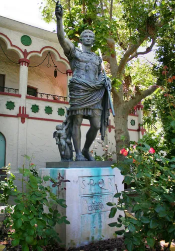 Replica statue of Augustus of Prima Porta amid flowering gardens
