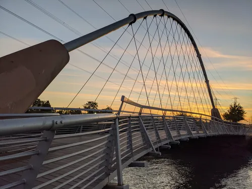 The pedestrian bridge spanning San Mateo Creek at dusk