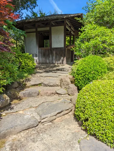 Stone path leads to traditional Japanese structure