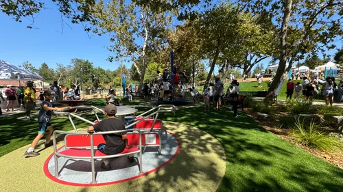 The large Magical Bridge Playground provides recreation under shady trees